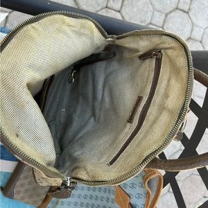 Older Dooney and Bourke bags. One is a tote the other a backpack with wallet.